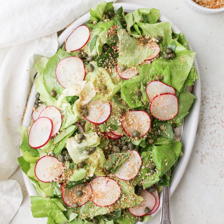 Butter (bibb) lettuce salad with thinly sliced radishes, capers, fresh basil, and a lemon honey vinaigrette with toasted bread crumbs.