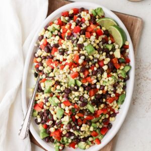 Corn and black bean salad with avocado and a zesty lime dressing.