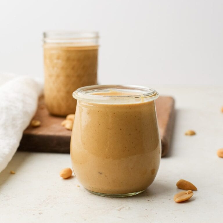 Two jars of homemade peanut butter.