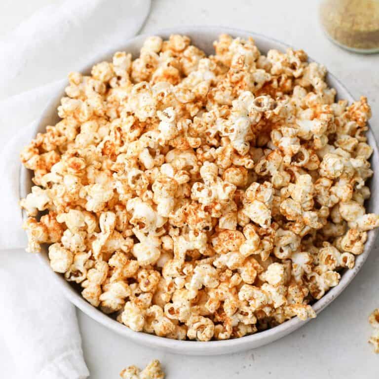 A large bowl of homemade popcorn with vegan popcorn seasoning.