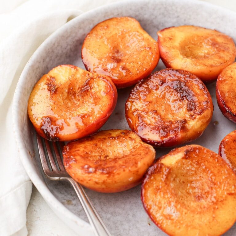 A shallow bow with caramelized peaches.