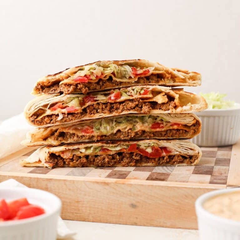 A stack of homemade crunchwrap supreme, but completely dairy free. A taco bell copycat recipe.
