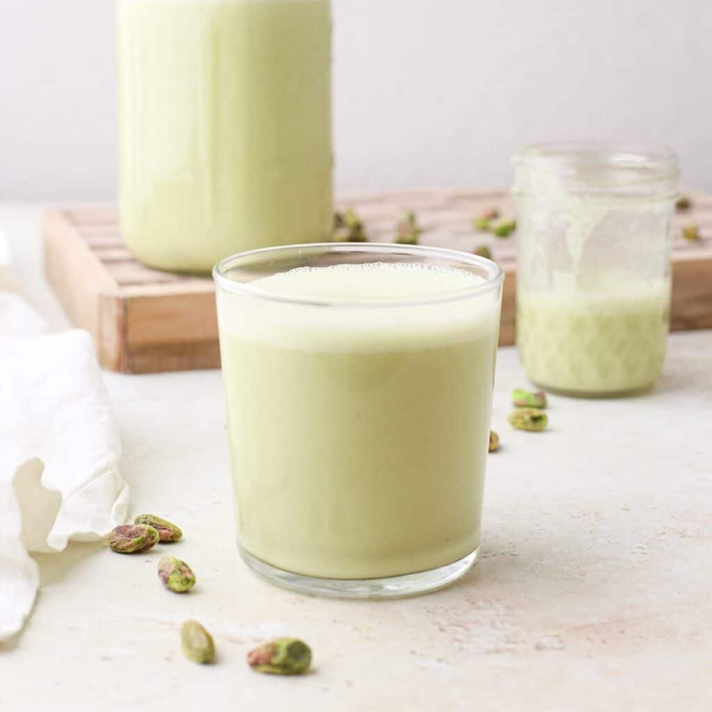 Three glasses of homemade pistachio milk.