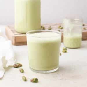 Three glasses of homemade pistachio milk.