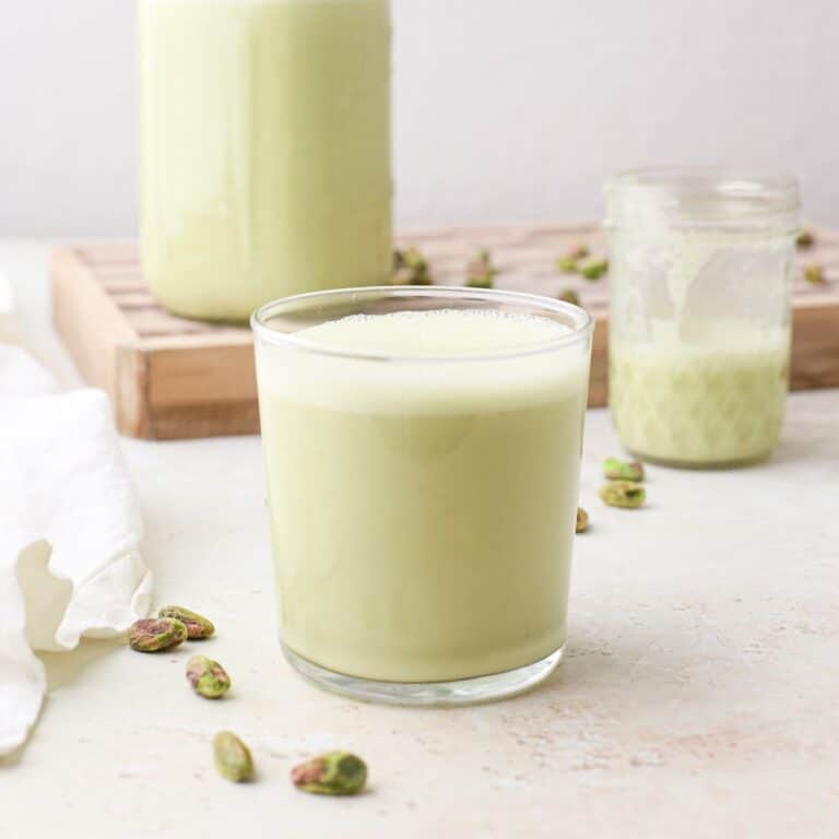 Three glasses of homemade pistachio milk.