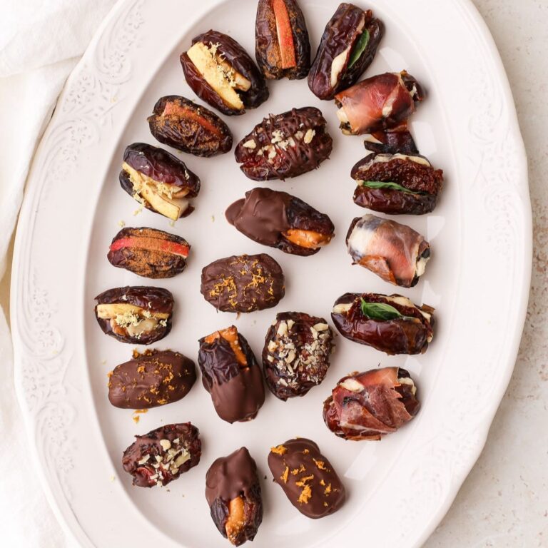 A plate of assorted stuffed dates, both sweet and savory.
