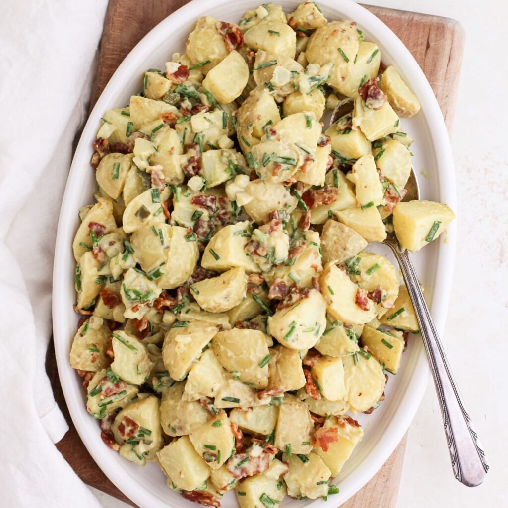 Honey mustard potato salad with bacon and chives.